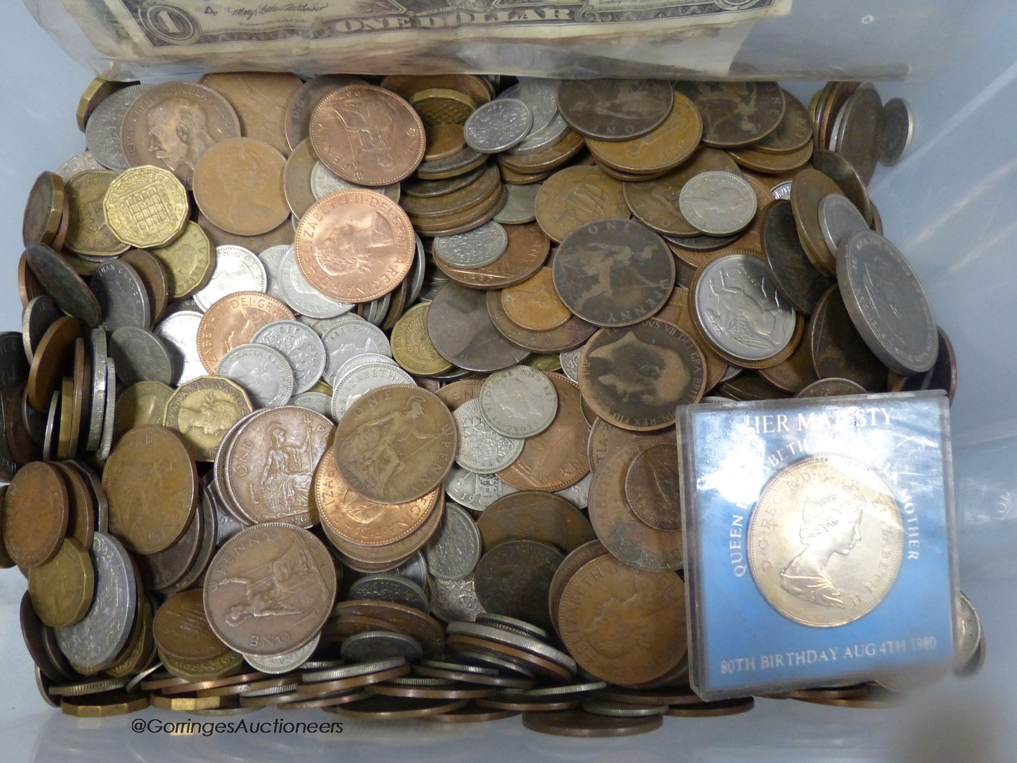 A collection of coins and bank notes